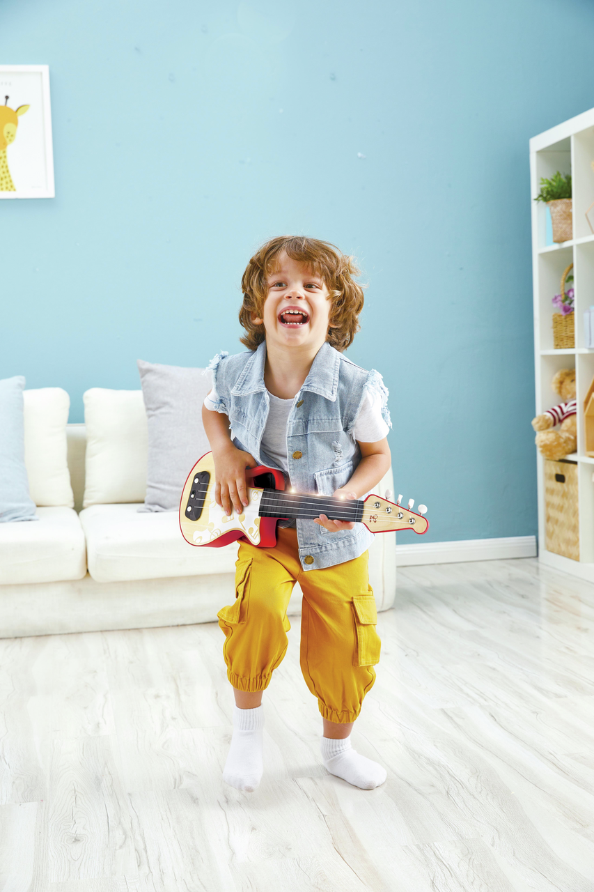 Ukulele rosso a ritmo di luci Ukulele rosso a ritmo di luci