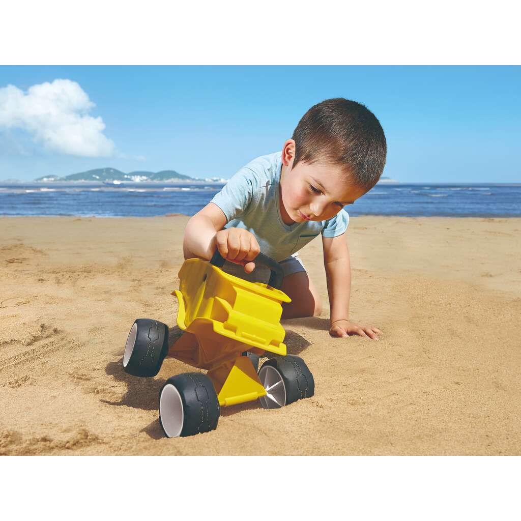 Autocarro giallo con cassone ribaltabile Autocarro giallo con cassone ribaltabile